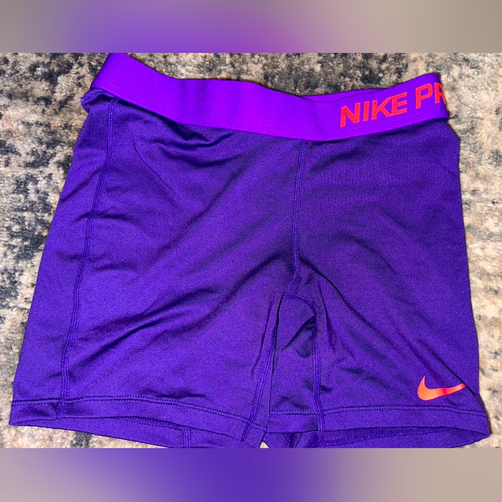 Purple and hot pink nike pros